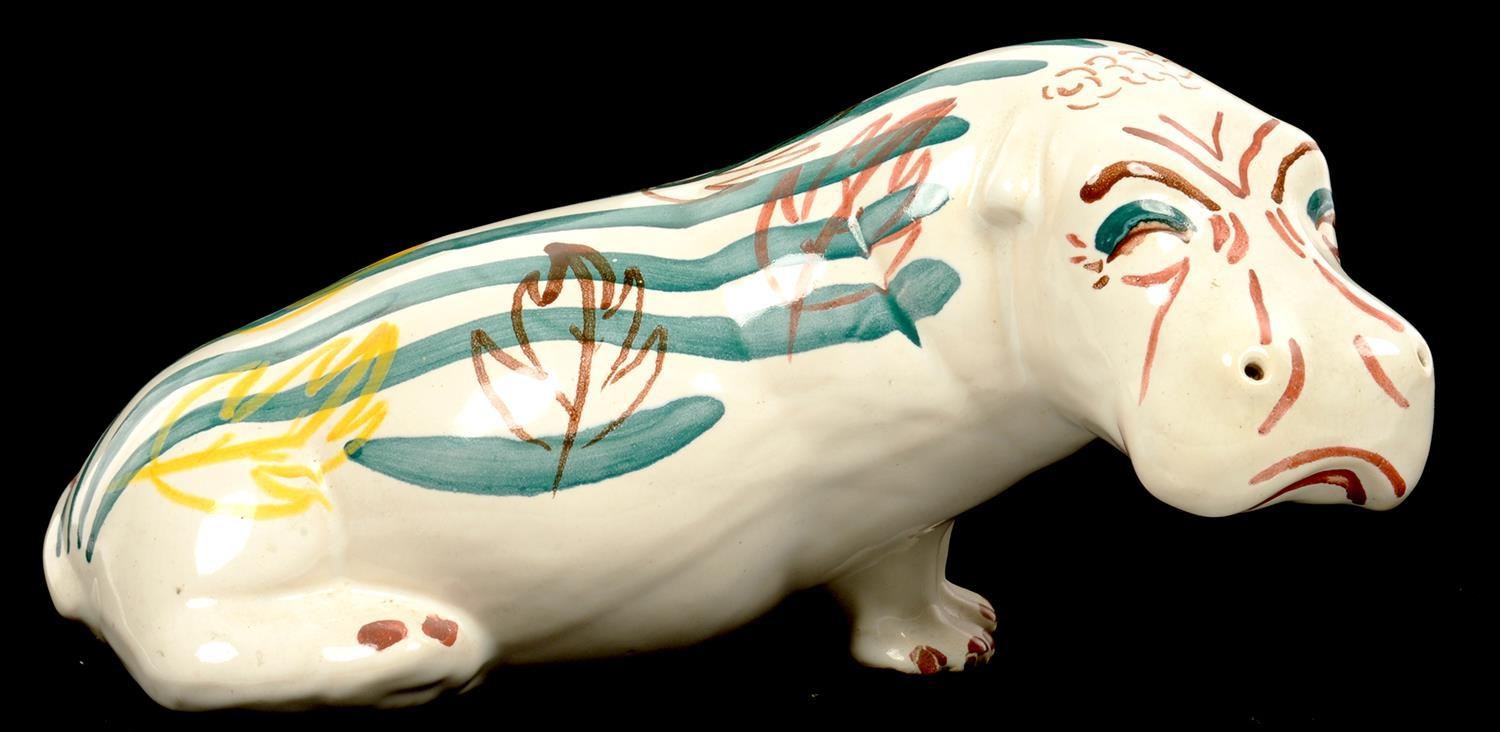 A C. H. BRANNAN SLIP WARE MODEL OF AN HIPPOPOTAMUS WITH PAINTED DECORATION, 25CM L, BLACK PRINTED