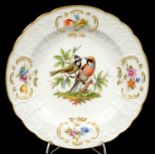 A MEISSEN MOULDED PLATE, PAINTED WITH BIRDS ON A BRANCH, IN FOUR FLORAL SPRAYS, 22.5CM D, UNDERGLAZE