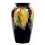 A MOORCROFT LEAF AND BERRY VASE, 11CM H, IMPRESSED MARKS, PAINTED INITIALS, C1930