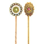 TWO GEM SET GOLD STICK PINS, ONE WITH WHITE ENAMEL TERMINAL SET WITH PERIDOT AND SPLIT PEARLS, THE