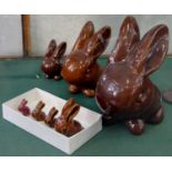 SIX DENBY BROWN DANESBY WARE MODELS OF MARMADUKE THE RABBIT AND ONE OTHER, IN RED GLAZE, 4 - 24CM H,