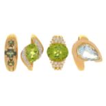 FOUR GEM SET 9CT GOLD RINGS COMPRISING AN AQUAMARINE RING, TWO PERIDOT AND DIAMOND RINGS AND A GREEN