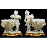 A PAIR OF STAFFORDSHIRE BONE CHINA PUTTI MUSICIAN FIGURAL VASES IN THE MANNER OR MOORE BROTHERS,