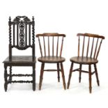 A VICTORIAN CARVED AND STAINED OAK HALL CHAIR WITH BOARDED SEAT AND SPIRAL TURNED UPRIGHTS AND A