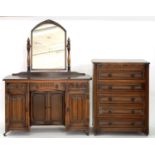 A CARVED OAK BEDROOM SUITE, COMPRISING TWO WARDROBES, CHEST OF DRAWERS, 80CM W, MIRROR BACKED