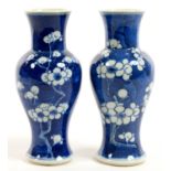 A PAIR OF CHINESE BLUE AND WHITE VASES, PAINTED WITH PRUNUS ON A CRACKED ICE GROUND, 19.5CM H,