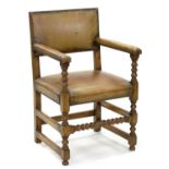 A VICTORIAN OAK ELBOW CHAIR COVERED IN NAILED BACK LEATHER, 58CM W