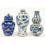 TWO CHINESE BLUE AND WHITE DOUBLE GOURD OR BALUSTER VASES AND A SIMILAR JAR AND COVER, 12.5CM H