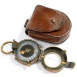 A BLACKENED BRASS PRISMATIC COMPASS, 8.5CM INCLUDING SUSPENSION RING, IN LEATHER CASE, C1900