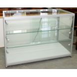 A MODERN GLAZED SHOWROOM CABINET, FITTED WITH ADJUSTABLE SHELVES AND SPOTLIGHTS, 90CM H; 120 X 60CM