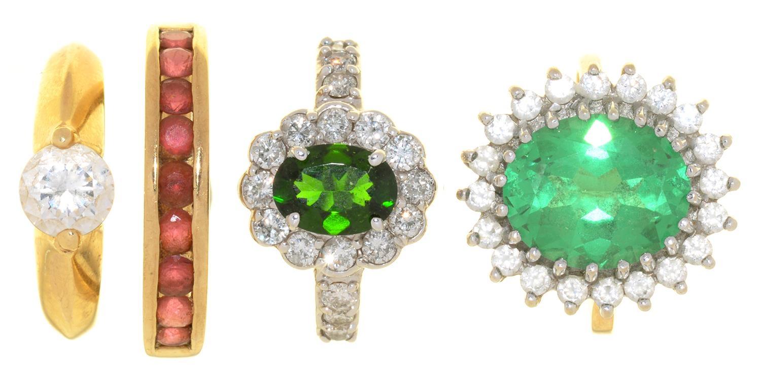 FOUR GEM SET GOLD RINGS COMPRISING A PERIDOT RING IN 14CT WHITE GOLD, TWO CUBIC ZIRCONIA RINGS IN