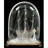 A 19TH C GLASS SHIP FRIGGER WITH SMALLER VESSEL TO FORE AND LIGHTHOUSE, ON PLATE GLASS BASE