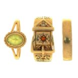 THREE GOLD RINGS COMPRISING A PERIDOT RING IN 9CT GOLD, A GARNET AND DIAMOND SET BUCKLE RING IN GOLD