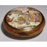 A JAPANESE SATSUMA EARTHENWARE ROUND BOX AND COVER,  MEIJI PERIOD  decorated with bejin and children