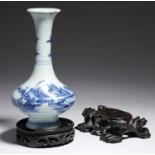 A CHINESE BLUE AND WHITE VASE, QING DYNASTY, 19TH C painted with a mountainous landscape, 18cm h and