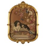 A VICTORIAN GILTWOOD AND BERLIN WOOLWORK FIRESCREEN, C1860   the leafy scrolling carved frame
