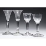 FOUR ENGLISH WINE GLASSES, C1750-80 with drawn trumpet, bell, ovoid or ogee bowl, one engraved