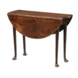 A GEORGE III MAHOGANY TABLE, C1770  the drop leaf, almost round top on tapering turned legs and