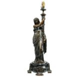 A FRENCH BRONZE  FIGURAL OIL LAMP, C1870  in the form of a woman holding a torch, on turned slate