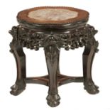 A CHINESE CARVED HARDWOOD STAND, LATE 19TH C  with stone inset top, 39cm h, 34cm diam Good