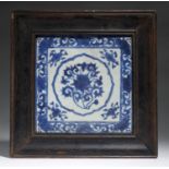 A CHINESE BLUE AND WHITE SCREEN TILE, QING DYNASTY, 18TH C  painted with a central lotus medallion