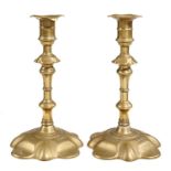 A PAIR OF ENGLISH BRASS CANDLESTICKS, MID 18TH C  with knopped stem and petal foot, 20.5cm h Good