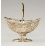 A GEORGE III FLUTED SILVER SUGAR BASKET with reeded handle, 13.5cm h, maker IH, probably Joseph
