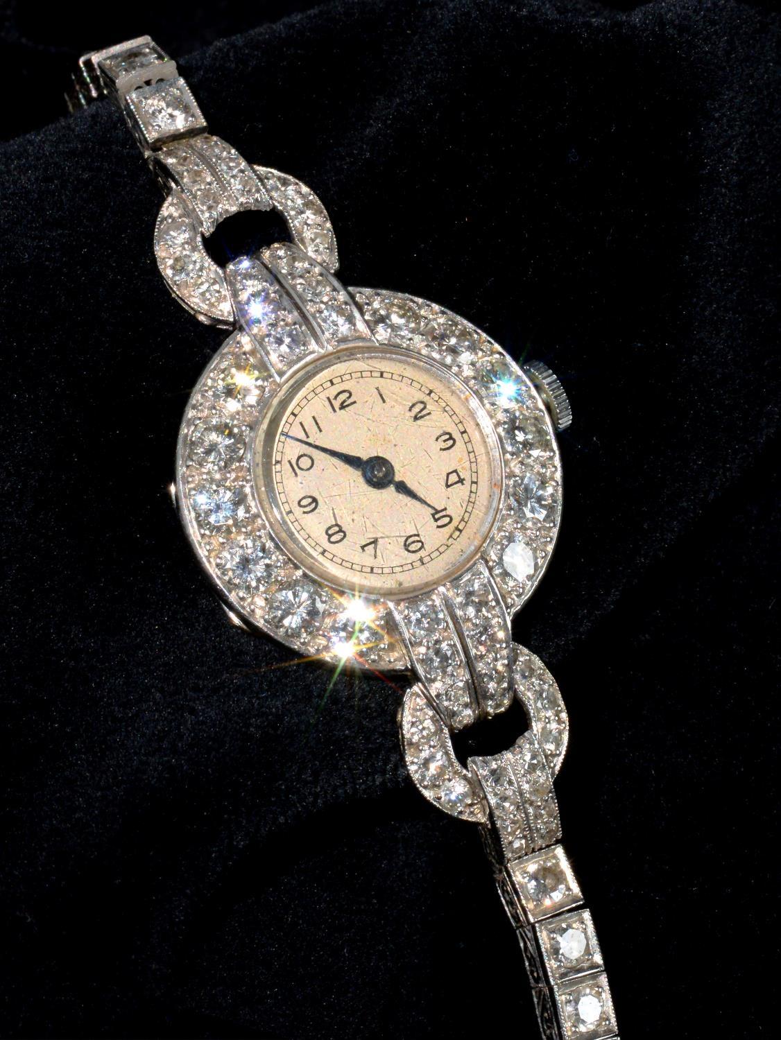 A DIAMOND COCKTAIL WATCH ON DIAMOND BRACELET, C1940 in platinum, 3.9 x 2.3cm including lugs Watch