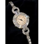 A DIAMOND COCKTAIL WATCH ON DIAMOND BRACELET, C1940 in platinum, 3.9 x 2.3cm including lugs Watch