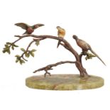 AN AUSTRIAN COLD PAINTED BRONZE GROUP OF PHEASANTS, C1930 on oval onyx base, 19cm h Paint dirty