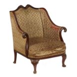 A MAHOGANY ARMCHAIR, C1900  the wing back and overscrolled arms crisply carved with eagles? heads,