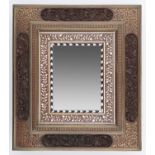 AN ANGLO INDIAN IVORY AND EBONY INLAID WOOD MIRROR, HOSHIARPUR, EARLY 20TH C the brass and copper