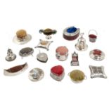SEVENTEEN VICTORIAN AND EDWARD VII SILVER NOVELTY PIN CUSHIONS including Arts & Crafts, bell shaped,