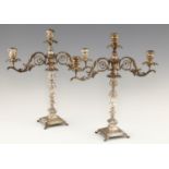 A PAIR OF PORTUGUESE SILVER CANDLESTICKS AND CONTEMPORARY THREE LIGHT CANDLE BRANCHES  the banded