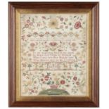 A ENGLISH LINEN SAMPLER, 1768 worked in well preserved silks with central inscription and motifs