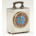 A LIBERTY & CO PEWTER TIMEPIECE, C1903  the lightly hammer textured bale shaped case inset with