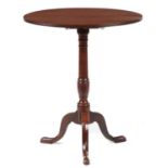 A GEORGE III MAHOGANY TRIPOD TABLE  the oval top with original brass latch, on slender vase