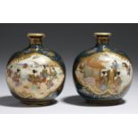 A PAIR OF JAPANESE SATSUMA GLOBULAR EARTHENWARE VASES, MEIJI PERIOD painted with scenes of