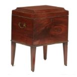 A GEORGE III MAHOGANY CELLARET, C1800  with cavetto lid, brass carrying handles and drum feet,