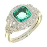 AN EMERALD AND DIAMOND CLUSTER RING in platinum. the central emerald approx 7 x 7 mm, marked 950 PT,