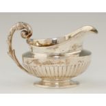 A GEORGE IV REEDED SILVER CREAM JUG with prow lip, 10cm h, by William Burwash, London 1821 and