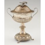 A SWEDISH SILVER CUP AND COVER  with parrot knop and leaf chased, domed base, on three paw feet,