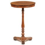 A ROSEWOOD LAMP TABLE, 19TH C the baluster pillar on platform and bun feet, 73.5cm h, 46cm diam