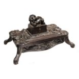 AN ANGLO INDIAN CARVED EBONY INKSTAND, CEYLON, SECOND HALF 19TH C  the lid with recumbent elephant