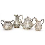 A VICTORIAN SILVER QUILTED BALUSTER TEA SERVICE