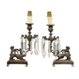A PAIR OF PATINATED BRASS LUSTRE CANDLESTICKS, EARLY 19TH C of curling grapevine form on rectangular
