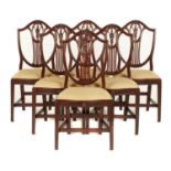 A SET OF SIX GEORGE II MAHOGANY SHIELD BACK DINING CHAIRS, C1800  with carved oval urn medallion