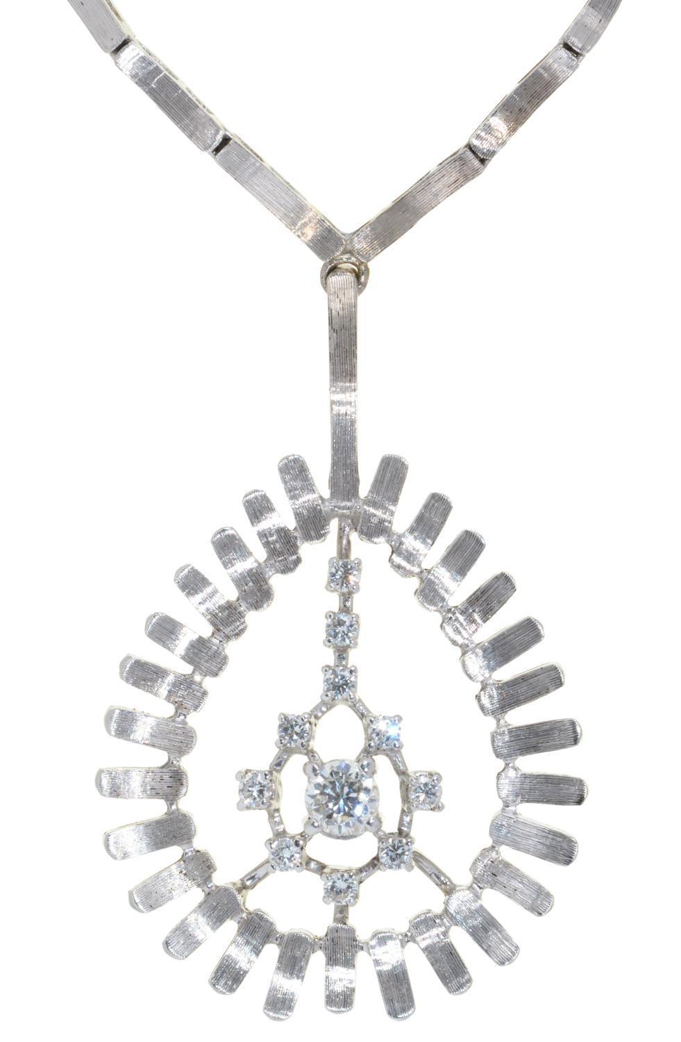 A DIAMOND PENDANT  on integral necklet, in 18ct white gold, 42 cm,  import marked London 1973, 30g