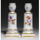 A PAIR OF MEISSEN DWARF CANDLESTICKS, C1900  painted with flowers and insects, 14cm h, incised