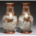 A PAIR OF JAPANESE KUTANI PORCELAIN VASES, MEIJI PERIOD enamelled and gilt with panels of birds in